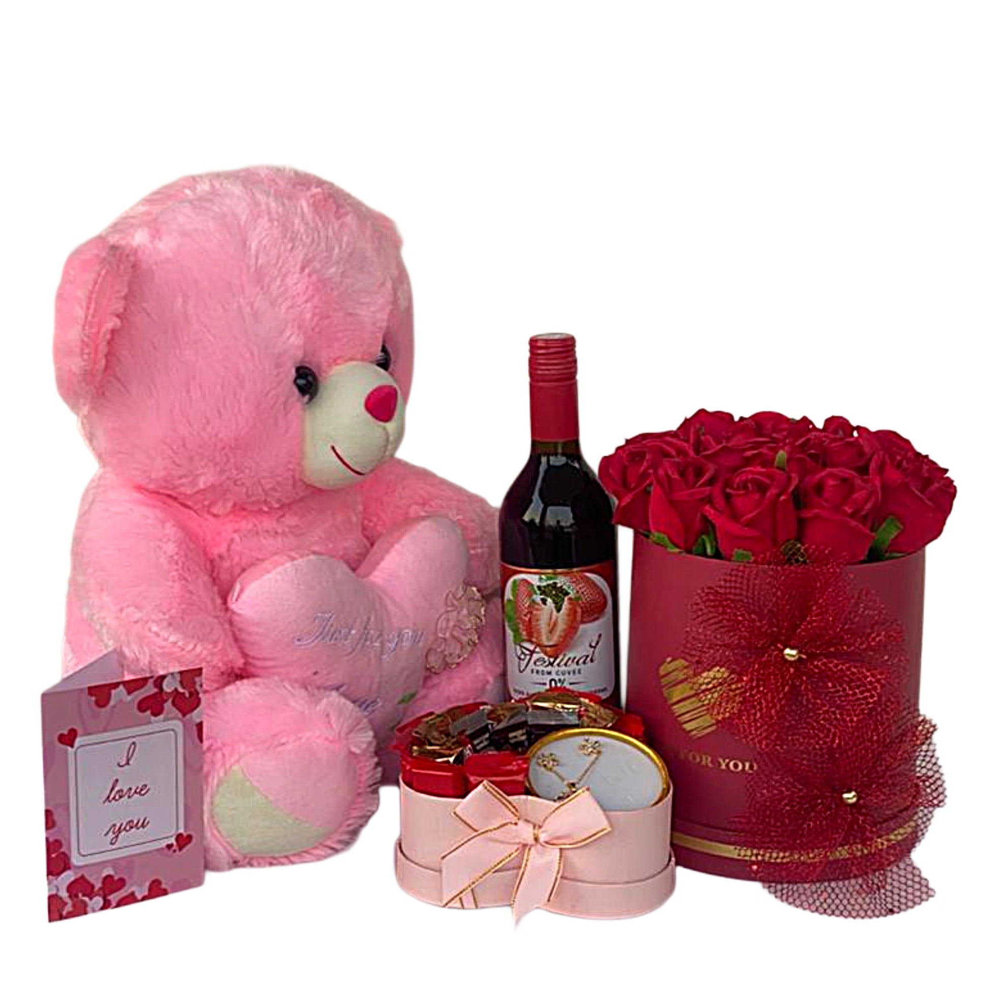 Pink teddy bear, bottle of wine, and bouquet of red roses on a white background