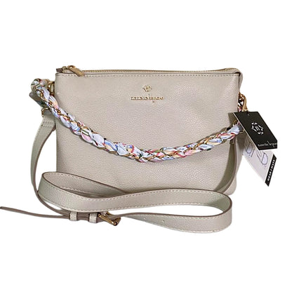 Beige handbag with a braided strap on a white background