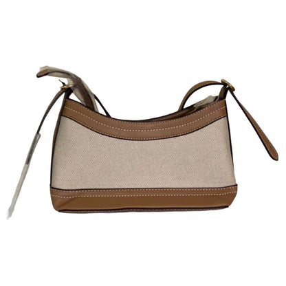 Handbag with beige body and brown accents on a white background