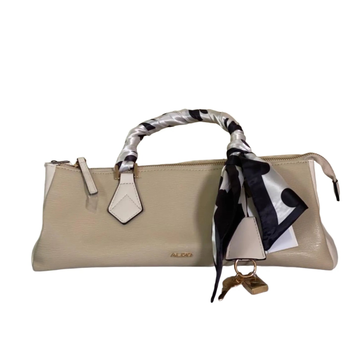 Beige handbag with a black and white scarf draped over the handle on a white background
