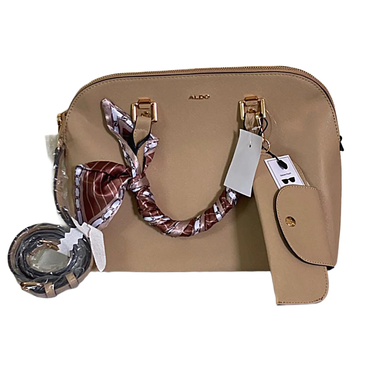 Beige handbag with a patterned scarf and tags on a white background