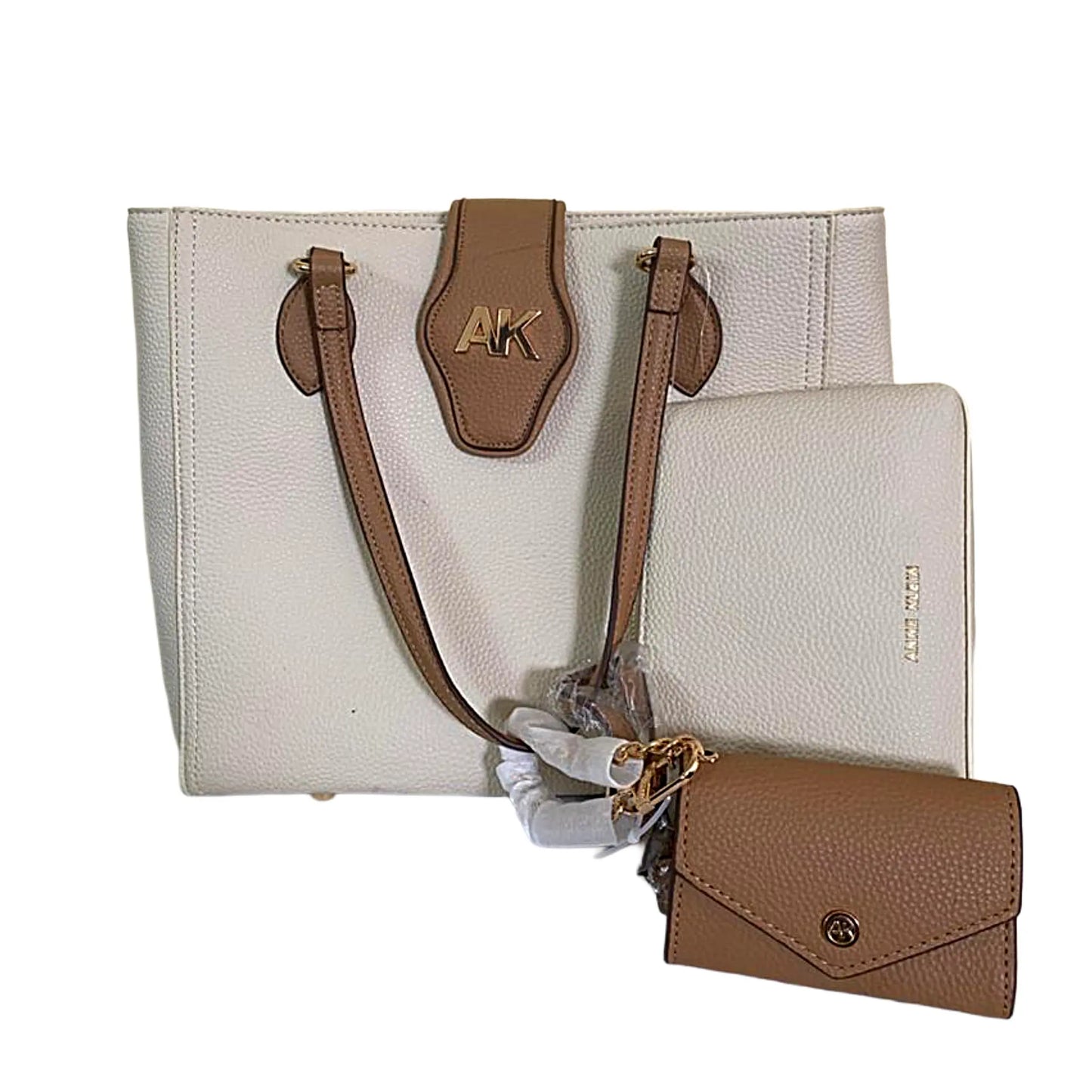 Beige handbag with brown accents and matching wallet on a white background