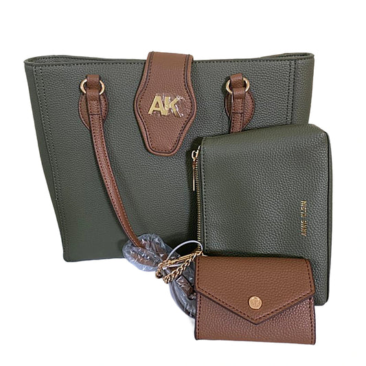 Green handbag with brown accents and a matching wallet on a white background