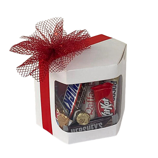 Box of assorted chocolate bars with a red bow on a white background