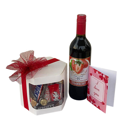 Bottle of strawberry-flavored wine with a gift box and card on a white background