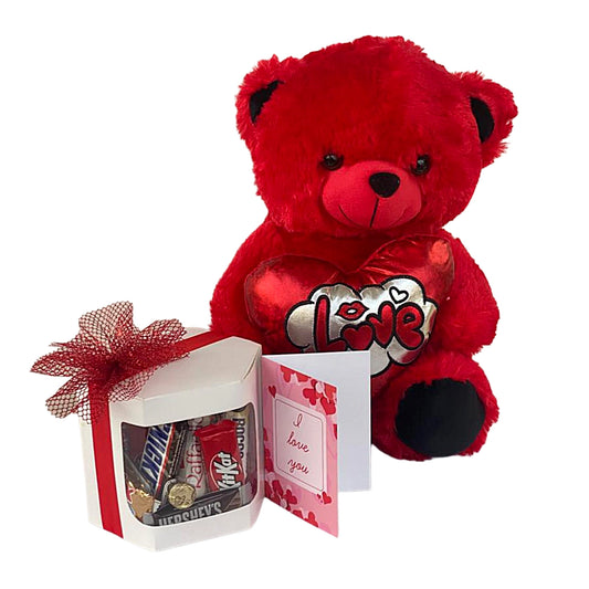 Red teddy bear with 'I love you' heart, gift box with candy, and card on a white background