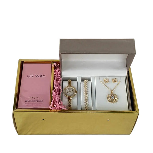 Gold jewelry set with a pink card in a gold box on a white background