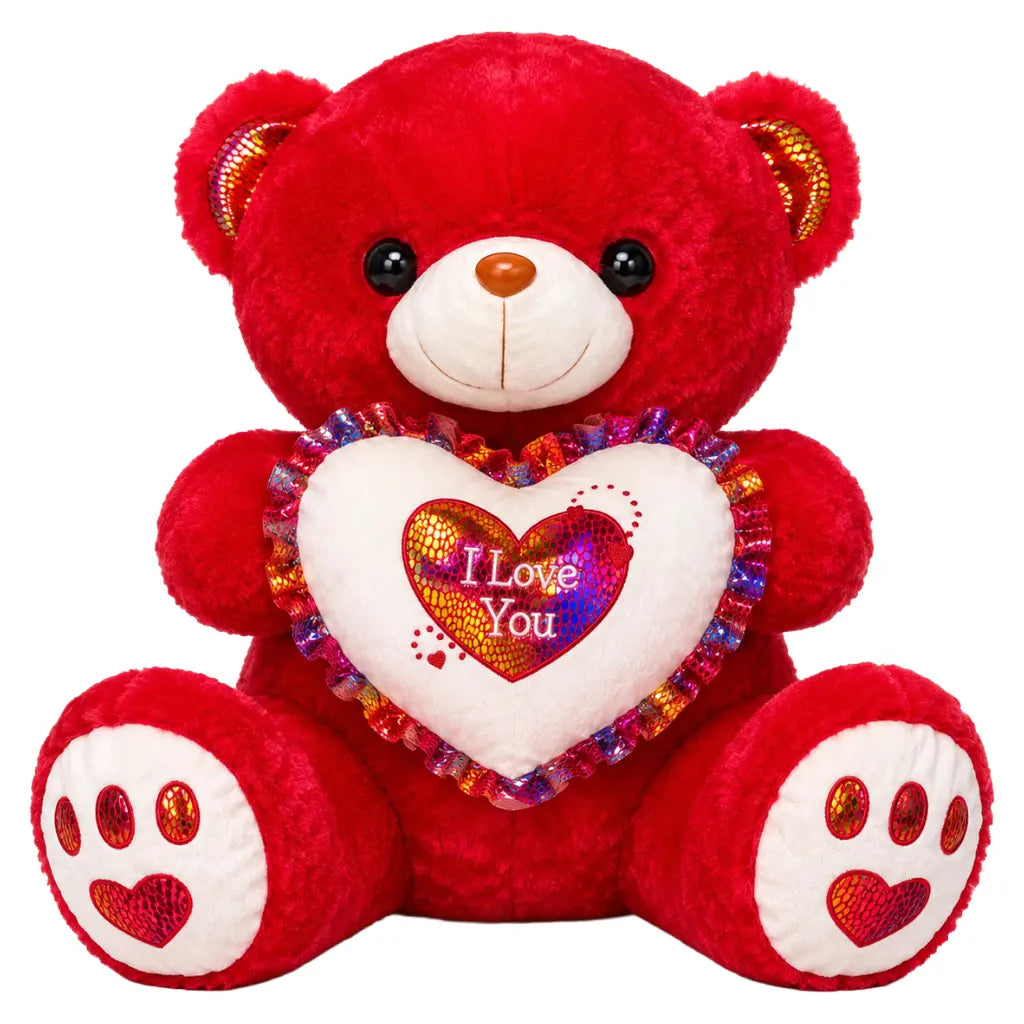 A red plush teddy bear holding a white heart-shaped pillow with colorful sequins and the words 'I Love You' in the center, shown on a plain white background.