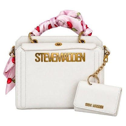 White Steve Madden handbag with a pink floral silk top handle, gold hardware, and a matching white leather key pouch with gold lettering, shown on a white background.