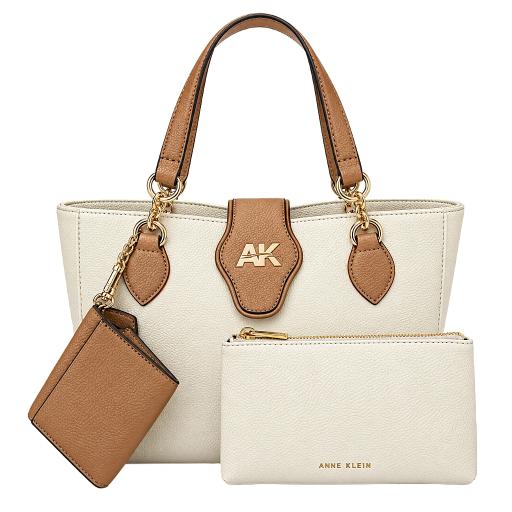 Anne Klein tote bag in off-white and tan leather with a matching zip pouch and key fob, featuring gold-tone hardware and an AK logo on the front.